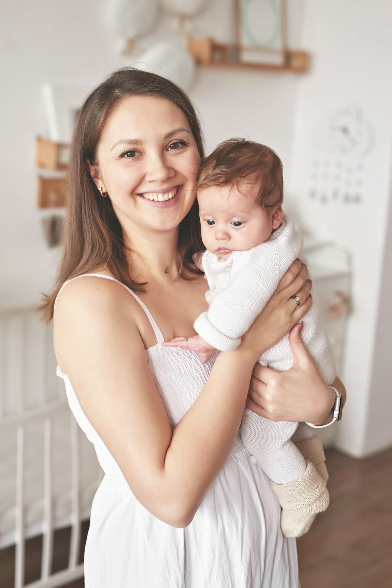 Happy mother's day. Parenthood and childhood. Mother and baby in nursery.