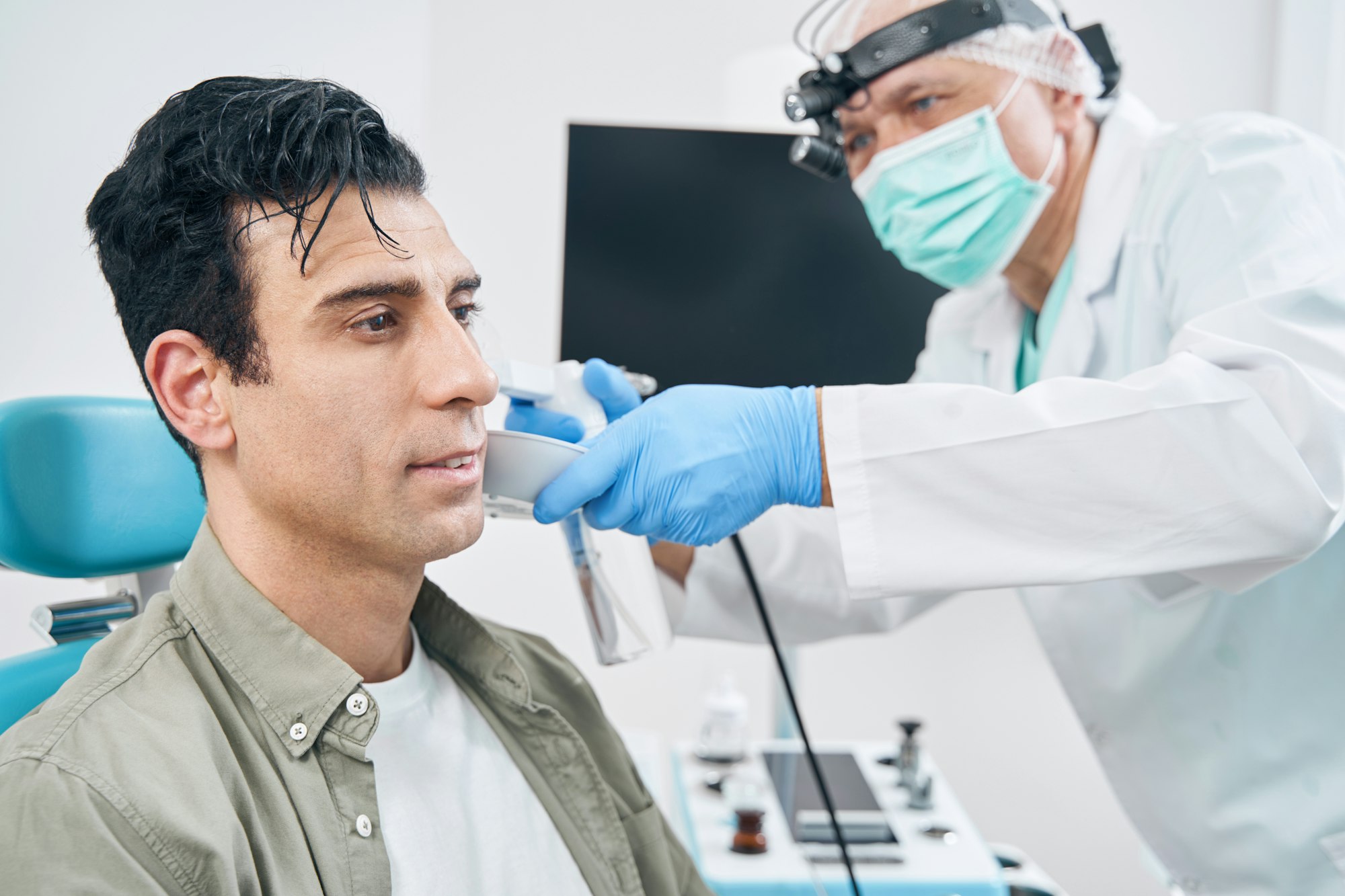 Medical worker providing treatment for adult men